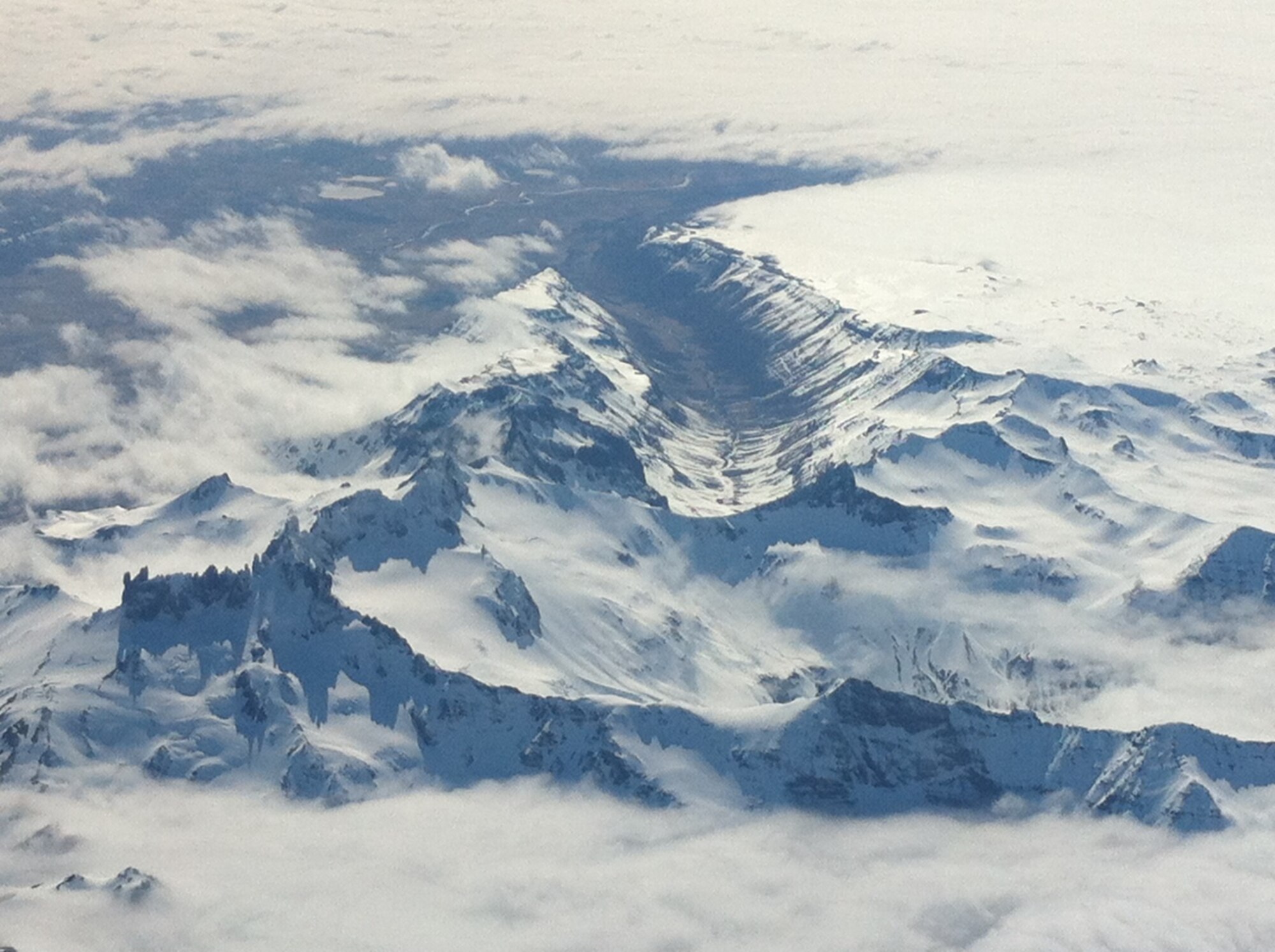 Mountains and glaciers appear far off in the distance as a Yokota C-12 crew approaches Cold Bay, Alaska. The team landed in Alaska on its return trip back to Yokota Air Base, Japan, with a newly maintained C-12 aircraft. (Courtesy photo)