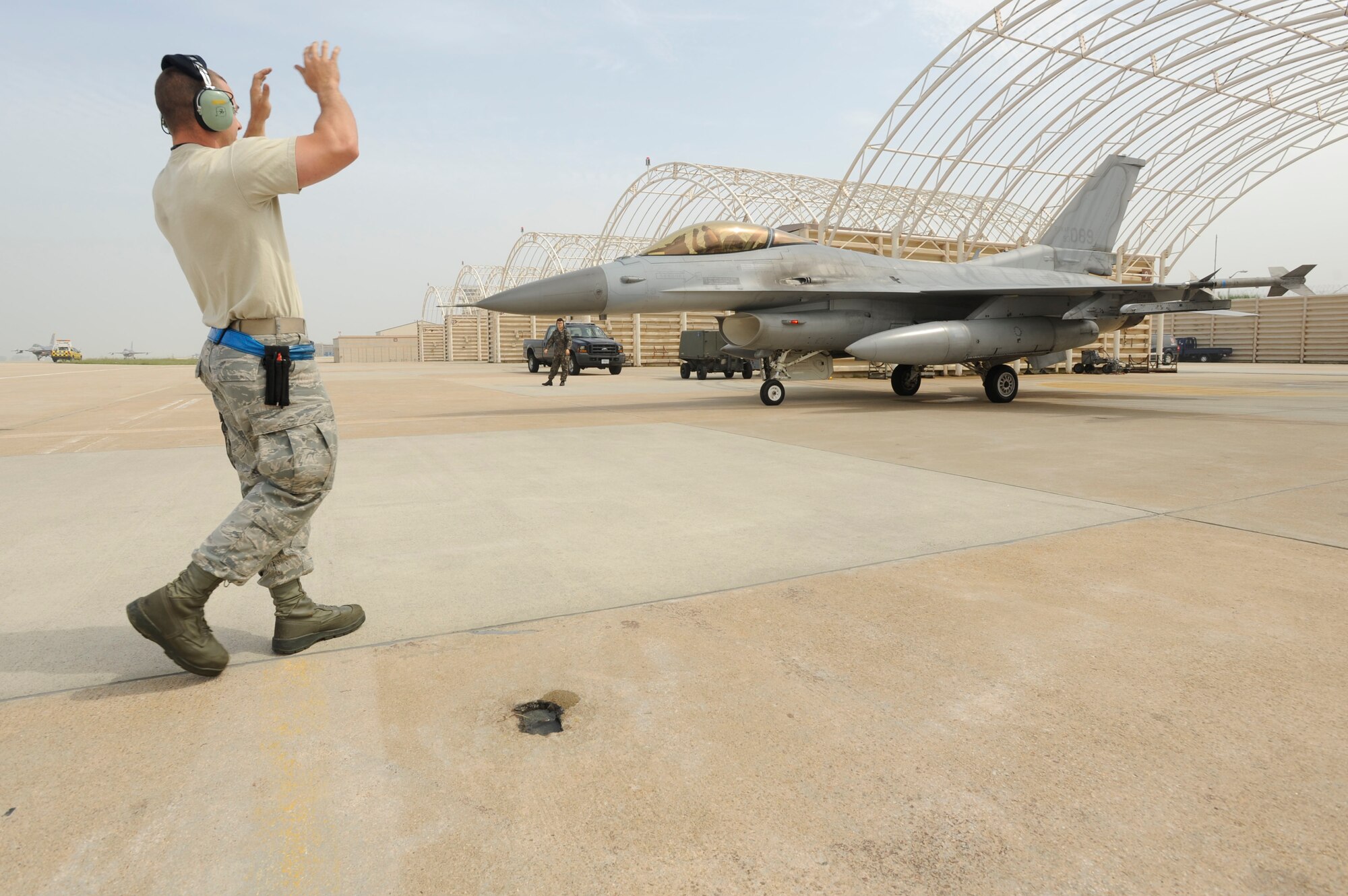 KUNSAN AIR BASE, Republic of Korea – Staff Sgt. Ken Washausen, 8th Maintenance Squadron, tactical aircraft maintenance crew chief, marshals Republic of Korea air force Capt. Kyoung Kwon Jin, 20th Fighter Wing, 120th Fighter Squadron pilot, Seosan Air Base, ROK, during a Buddy Wing Exchange at Kunsan AB, ROK, May 23, 2013. The exchange program gave ROKAF and U.S. pilots an opportunity to fly together in a realistic training scenario. (U.S. Air Force photo by Staff Sgt. Tong Duong/ Released)  