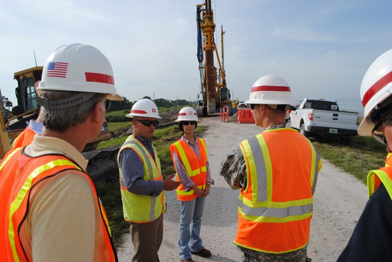 Col. Alan Dodd (right), district commander, is briefed by Mario Fuquene and Eva Porras on cutoff wall installation near Canal Point during a visit to Herbert Hoover Dike in October.  Rehabilitation work at the dike was recently named the Outstanding Project of the Year by the American Society of Civil Engineers, Palm Beach Branch. 