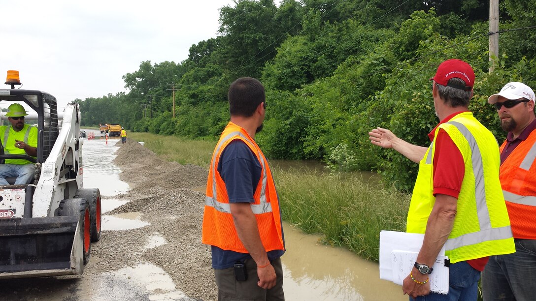 June 5, 2013 - Members of the St. Louis District Flood Fight team are providing technical assistance to the Missouri Department of Transportation by continuing to fortify the line of protection along Highway 367 between the flooded area and West Alton, Mo. Following a levee overtopping at Kuhs and a breach in the Consolidated North County levee, flood water inundated the basin at the confluence of the Mississippi and Missouri Rivers on Tuesday, June 4, 2013.