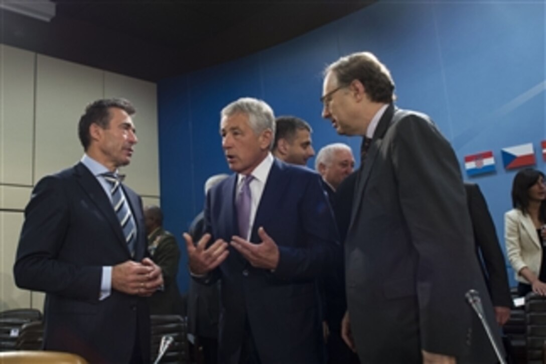 Secretary of Defense Chuck Hagel, center, speaks with NATO Secretary General Anders Fogh Rasmussen, left, and NATO Deputy Secretary General Ambassador Alexander Vershbow, right, prior to a meeting of the Georgia Commission at NATO headquarters in Brussels, Belgium, on June 5, 2013.  