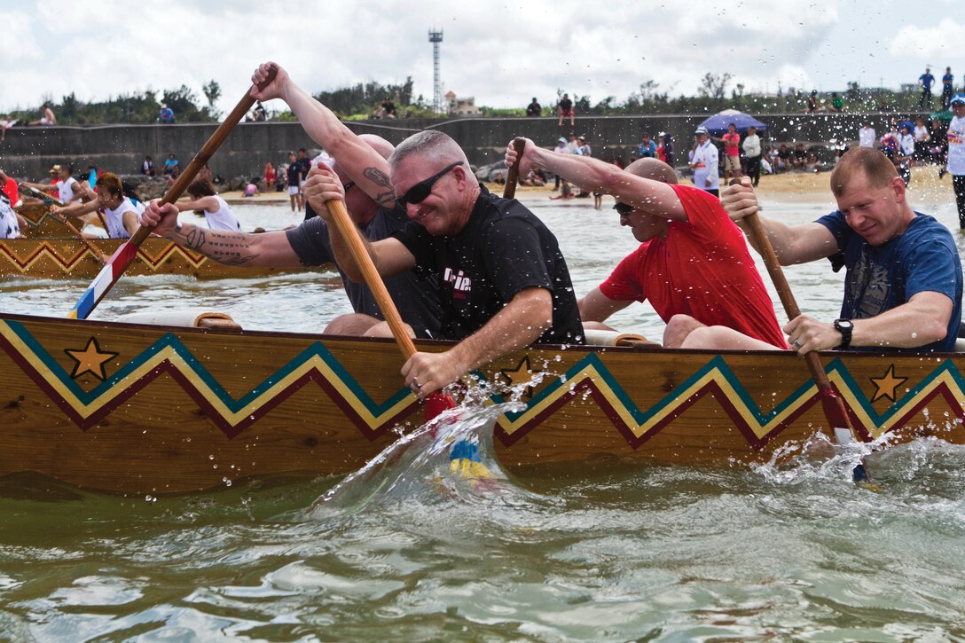 Teams consisting of Okinawa community members and U.S. service members make final preparations for the annual Henoko dragon boat races at Matsuda-No-Hama Beach June 2. During the races, each boat held 10 people consisting of eight rowers, one drummer who acts as the team’s pacesetter and a coxswain to steer the craft. Photos by Lance Cpl. Kasey Peacock