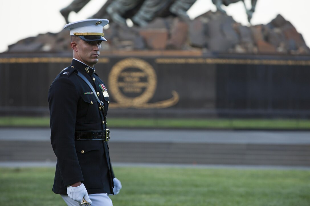 Capt. Adam S. Maddock, a platoon commander with Company B, Marine Barracks Washington, D.C., passes in review during a Tuesday Sunset Parade at the Marine Corps War Memorial in Arlington, Va., June 4.