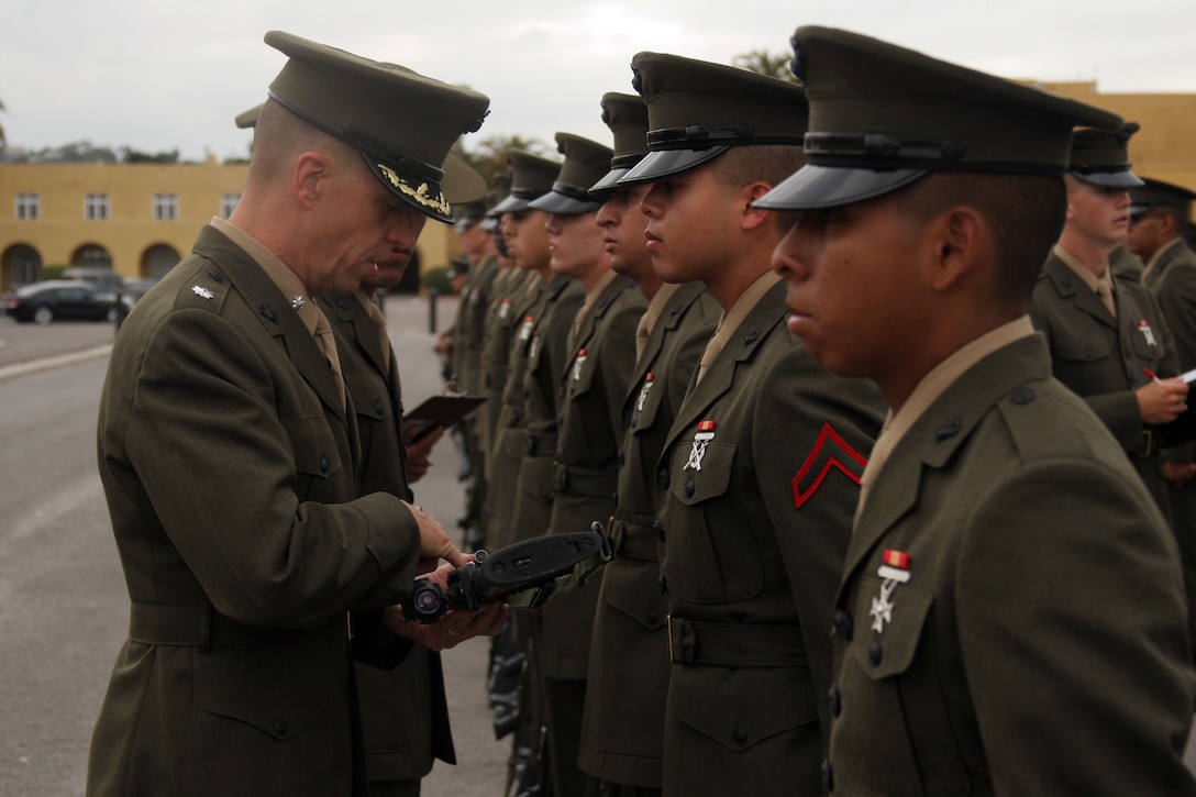 Lt. Col. Daniel R. Kazmier, commanding officer, 1st Recruit Training Battalion, inspects Marines of Company A during Battalion Commander’s inspection aboard Marine Corps Recruit Depot San Diego, June 4. Marines are expected to uphold uniform regulations, weapon cleanliness and have a strong grasp of Marine Corps knowledge.  