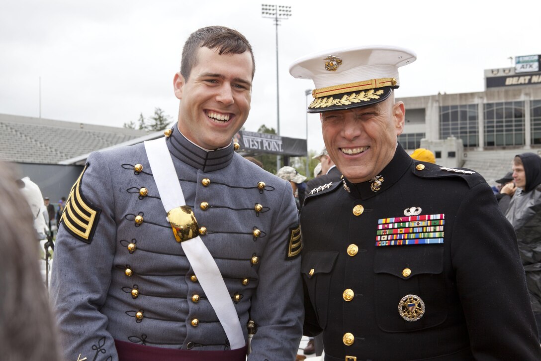 The Assistant Commandant of the Marine Corps, Gen. John M. Paxton, Jr., right, shares a moment with recent graduate Thul after the United States Military Academy Graduation and Commissioning Ceremonies for the Class of 2013 at the Michie Stadium, West Point in NY, May 25, 2013. Gen. Paxton personally commissioned 2nd Lt. Christopher V. Posadas, not shown, into the Marine Corps after the event. (U.S. Marine Corps photo by Cpl. Tia Dufour/Released)