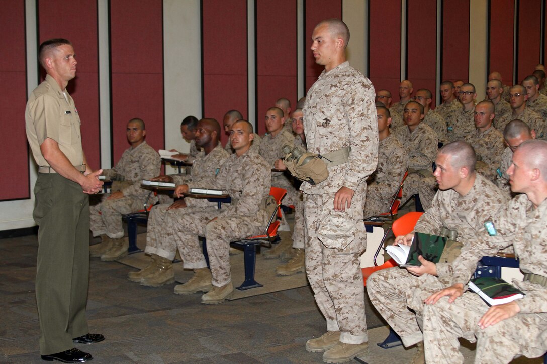 Capt. Noah M. Morrisey, series commander, Company I, 3rd Recruit Training Battalion, asks recruits what their definition of honor is aboard Marine Corps Recruit Depot San Diego May 30. Honor is taught in recruit training along with other Corps values such as courage and commitment. (U.S. Marine Corps photo by Cpl. Walter D. Marino II, released)