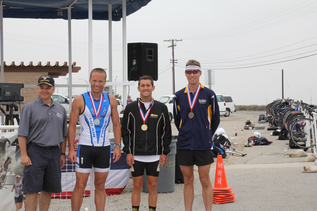 Medalists of the 2013 Armed Forces Triathlon Championship from left to right:  Silver - Maj James Bales (USAF), Keesler AFB, MS - 1:49:57; Gold CPT Nicholas Sterghos (USA), Ft. Hood, TX - 1:49:21; Bronze - LT Thomas Brown (USN), San Diego, CA - 1:50:20 