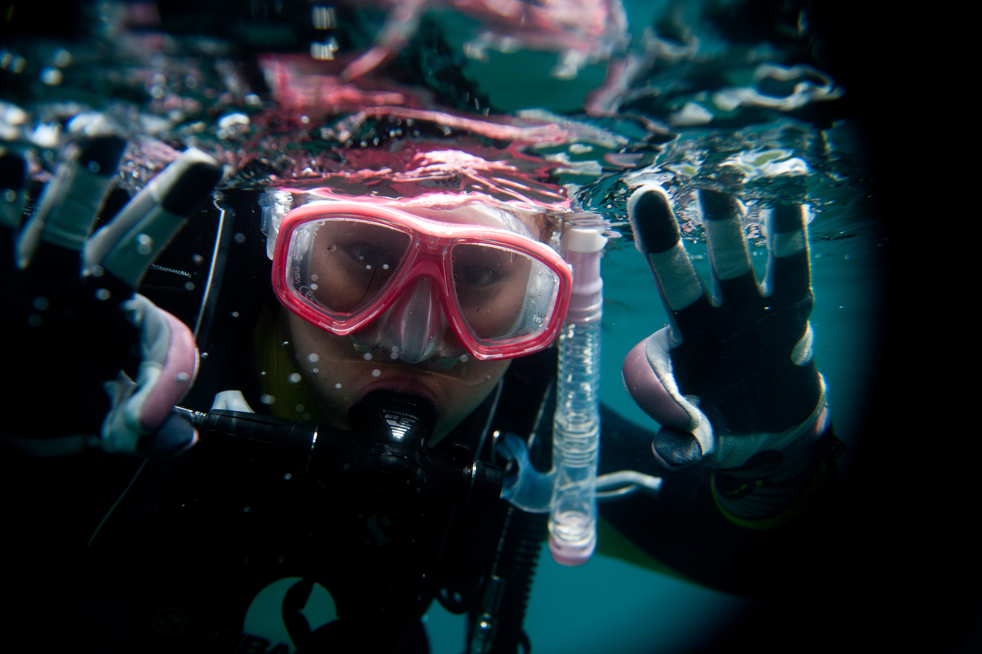LAKE MOTOSU, Japan -- Mendy Ornellas, Yokota Air Base Dive Club member, signals to teammates that she is ready for dissent during a volunteer dive at Lake Motosu, Japan, June 1, 2013. Ornellas and her six teammates are all part of the dive club at Yokota which assisted in Motosuko Cleanup, a local volunteer project to remove debris from the lake bottom. (U.S. Air Force photo by Senior Airman Cody H. Ramirez)