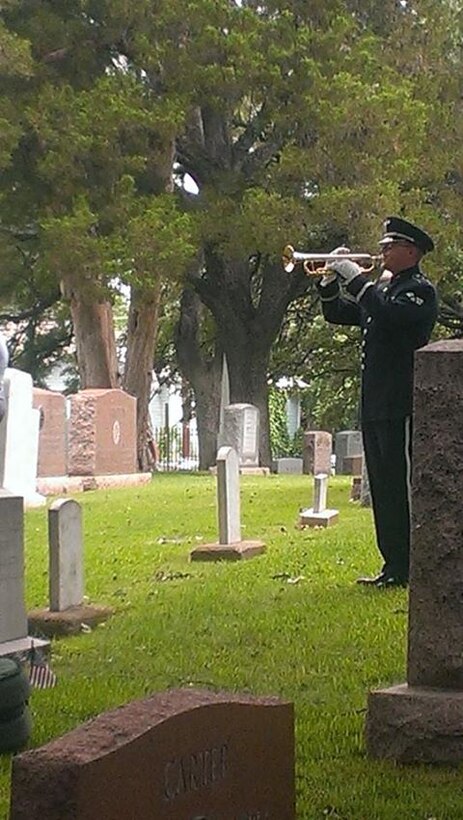 SrA Daniel Thrower performs "Taps" at the Texas State Cemetary in Austin, TX.