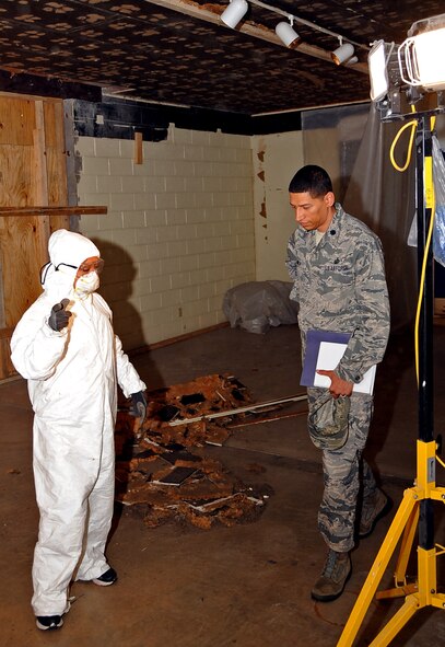 Master Sgt. Editha Decuir, Barksdale Global Power Museum staff, explains renovation and exhibit plans for a room under construction to Lt. Col. Anthony Smith 2nd Comptroller Squadron commander, at Barksdale Air Force Base, La., May 30, 2013.  Three out of seven rooms at the museum are being renovated to update and bring new exhibits into the museum. (U.S. Air Force photo/Staff Sgt. Jason McCasland)