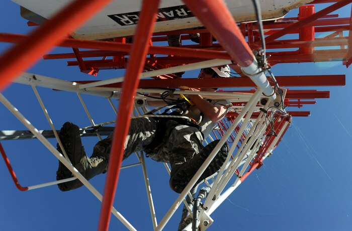 A member from the Air Force Flight Standards Agency works on an Instrument Landing Systems tower May 14, 2013. Beale recently completed a landing system upgrade June 4 to aid pilots while landing. (U.S. Air Force photo by Airman 1st Class Bobby Cummings/Released)