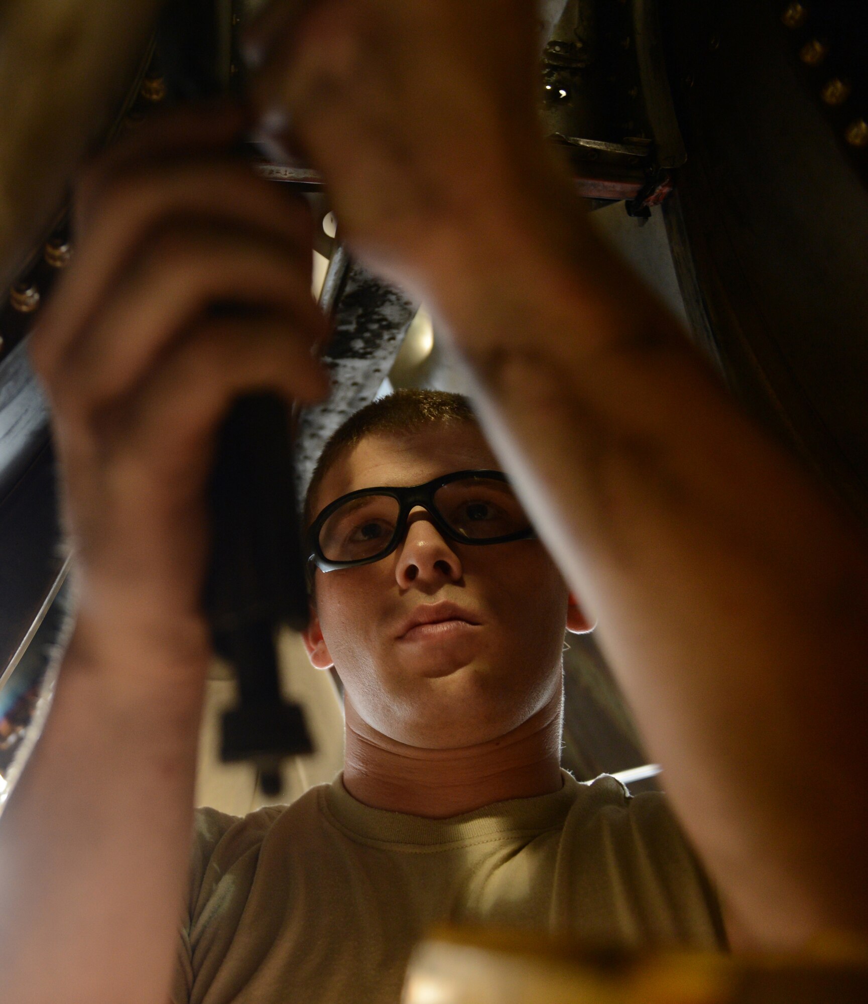 Airman 1st Class Brandon Smith, 2nd Maintenance Squadron, installs safety wire to a Y-duct of a B-52H Stratofortress in the Phase Hangar on Barksdale Air Force Base, La., June 5, 2013.Y-ducts are inspected to ensure there are no dents, cracks, corrosion or discrepancies. (U.S. Air Force photo/Senior Airman Micaiah Anthony) 