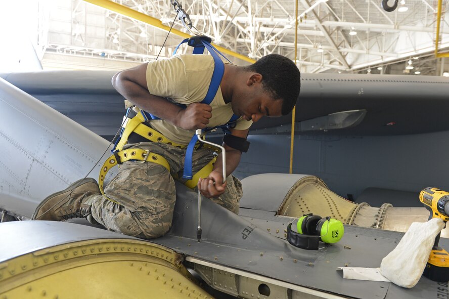 Airman 1st Class Mikel Stephens, 2nd Maintenance Squadron, uses a speed handle to secure a panel on a B-52H Stratofortress in the Phase Hangar on Barksdale Air Force Base, La., June 5, 2013. Phase inspections are conducted after a B-52H accumulates more than 450 flying hours. (U.S. Air Force photo/Senior Airman Micaiah Anthony)