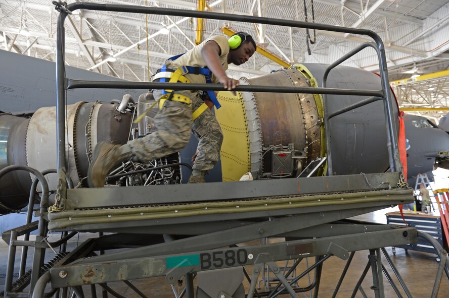 Airman 1st Class Mikel Stephens, 2nd Maintenance Squadron, positions a stand in the Phase Hangar on Barksdale Air Force Base, La., June 5, 2013. Stephens positioned the stand so he could gain access to the top of an engine pod. (U.S. Air Force photo/Senior Airman Micaiah Anthony)