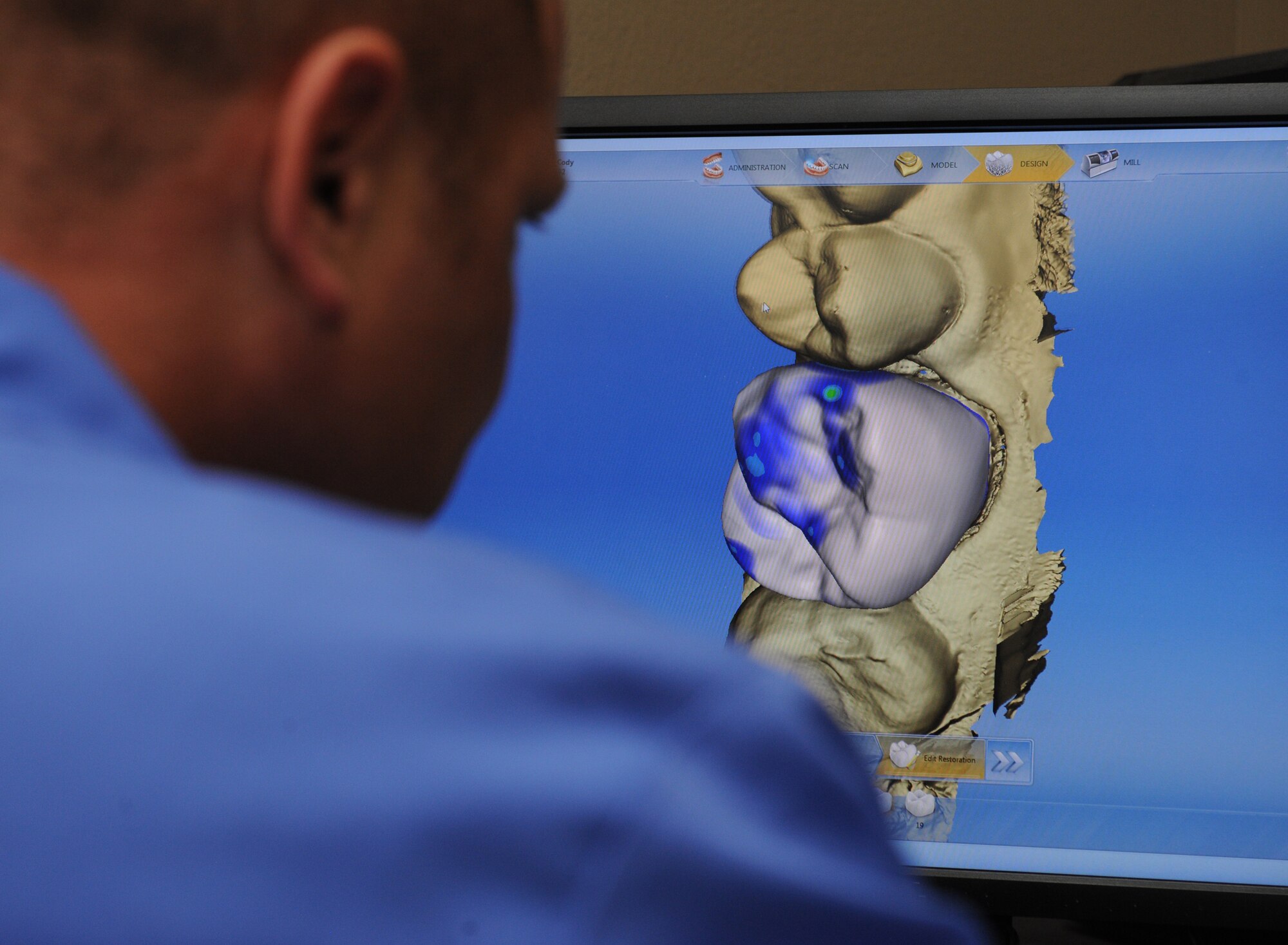 Master Sgt. William Fitzpatrick, 2nd Dental Squadron lab technician, creates a digital crown using a computer aided design program on Barksdale Air Force Base, La., June 6, 2013. Technicians can either create a crown by hand or design one graphically. A patient's teeth will be photographed and then processed digitally for technicians to work on. (U.S. Air Force photo/Airman 1st Class Benjamin Gonsier)
