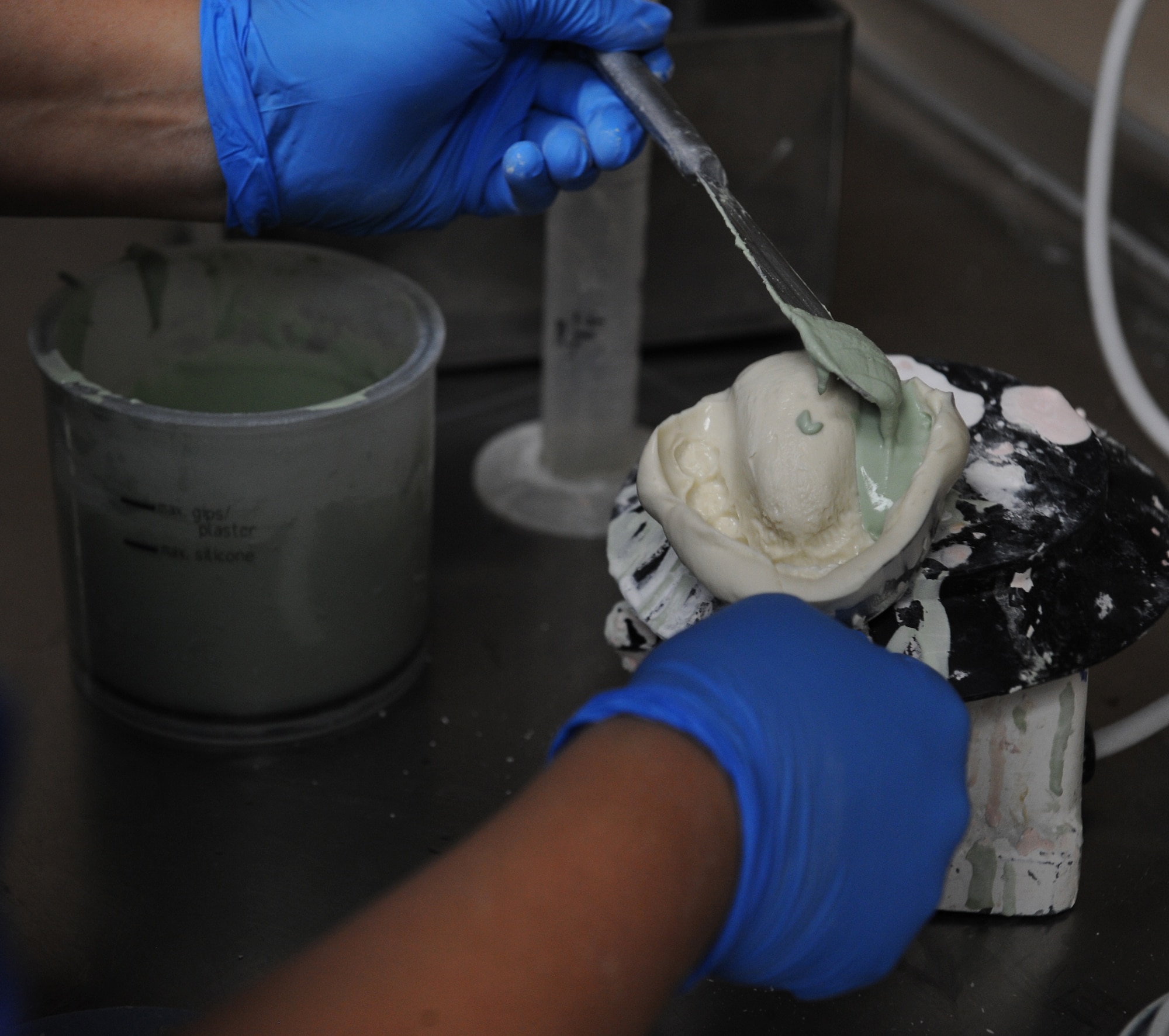 Staff Sgt. Heather Nowak, 2nd Dental Squadron dental lab technician, fills a mouth mold with dental stone on Barksdale Air Force Base, La., June 6, 2013. The dental laboratory makes more than 15 dental molds a month for Airmen who need braces. (U.S. Air Force photo/Airman 1st Class Benjamin Gonsier)