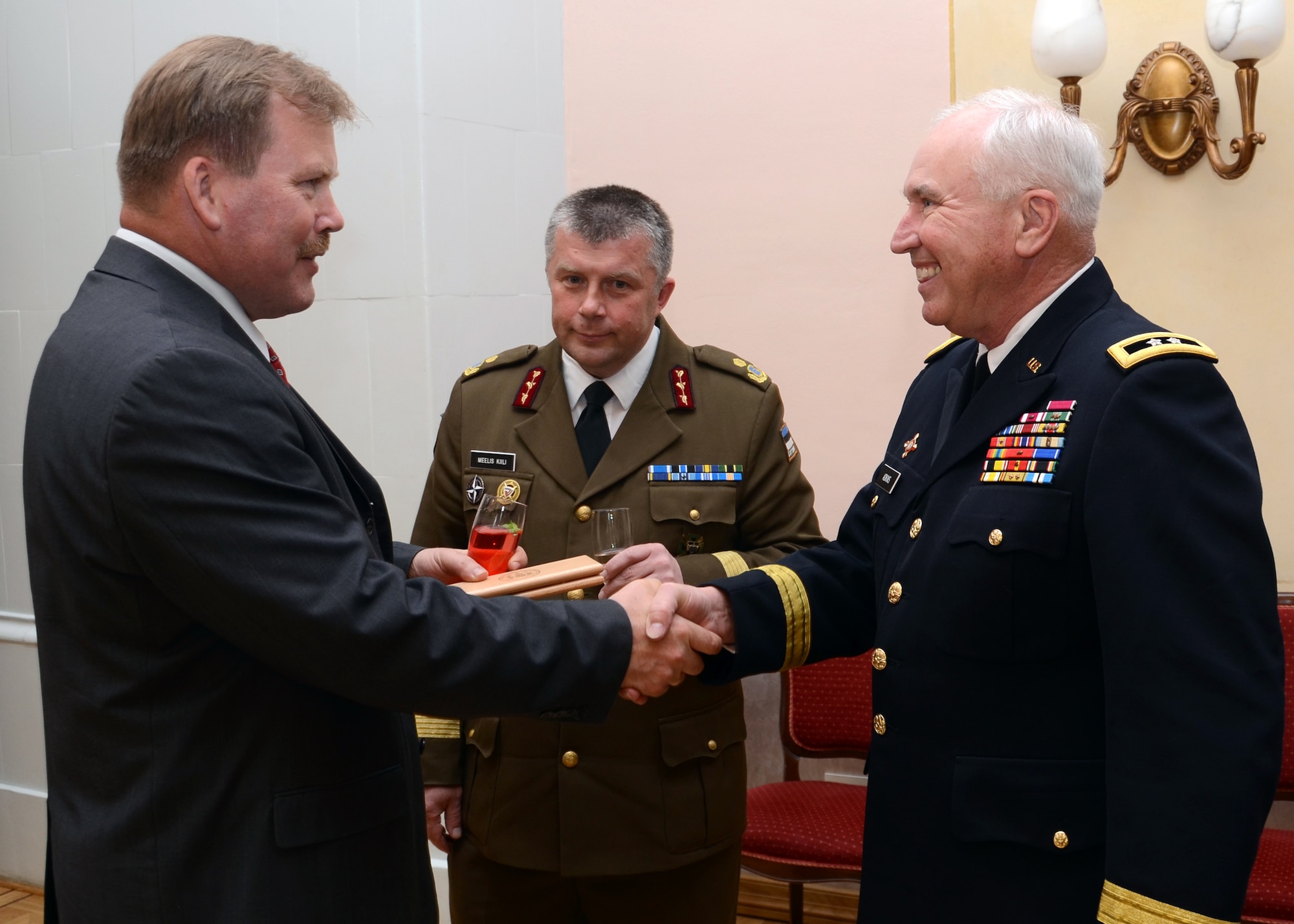 U.S. Army Maj. Gen. James Adkins, The Adjutant General, Maryland National Guard, presents a memento to the Estonian Defense League at Alu Manor in Raplamaa, Estonia is the site for the 20th anniversary celebration state partnership program between the Estonian Military and the Maryland National Guard on June 4, 2013.  Gen. Adkins traveled to Estonia to celebrate this accomplishment during Sabre Strike 2013.  Saber Strike 2013 is a U.S. Army Europe-led, multinational, tactical field training and command post exercise occurring in Lithuania, Latvia and Estonia June 3-14 that involves more than 2,000 personnel from 14 different countries. The exercise trains participants on command and control as well as interoperability with regional partners and is designed to improve  joint, multinational capability in a variety of missions and to prepare participants to support multinational contingency operations worldwide. (U.S. Air National Guard photo by Staff Sgt. Benjamin Hughes)