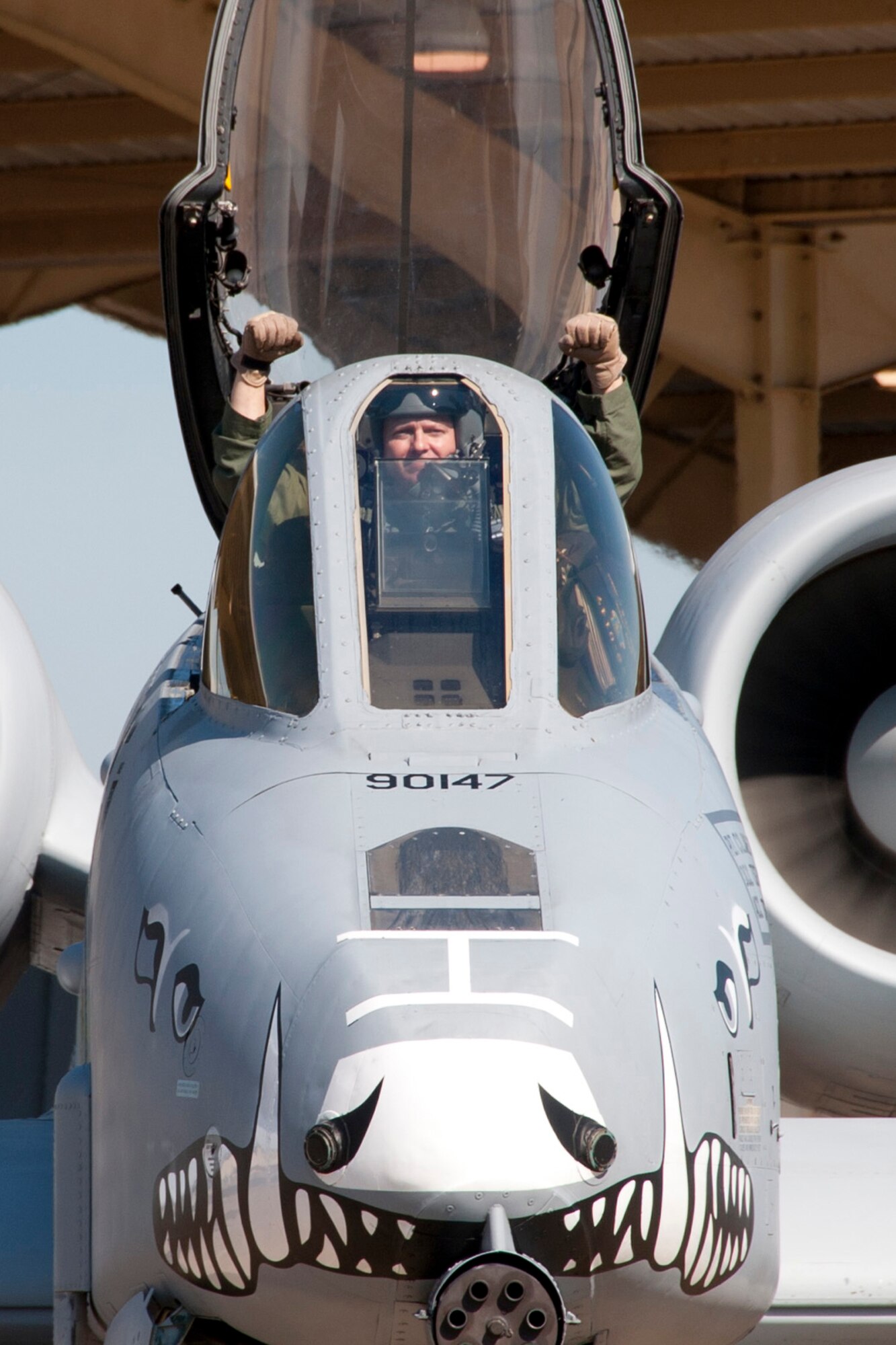 U.S. Air Force Col. James Travis, commander, 47th Fighter Squadron, gives a little pump as he taxis an A-10 Thunderbolt II on the ramp at Barksdale Air Force Base, La., June 3, 2013. Colonel Travis was piloting one of six A-10s being transferred to Davis-Monthan Air Force Base, Ariz., on that day. The 47th Fighter Squadron guidon was packed into the travel pod of the aircraft for delivery to Davis Monthan with the colonel’s aircraft. The transfer of all the A-10s from Barksdale is due to the recent Force Structure Action Implementation Plan that dictates the 917th Fighter Group at Barksdale will be inactivated this year on the last day of September. (U.S. Air Force photo by Master Sgt. Jeff Walston/Released)