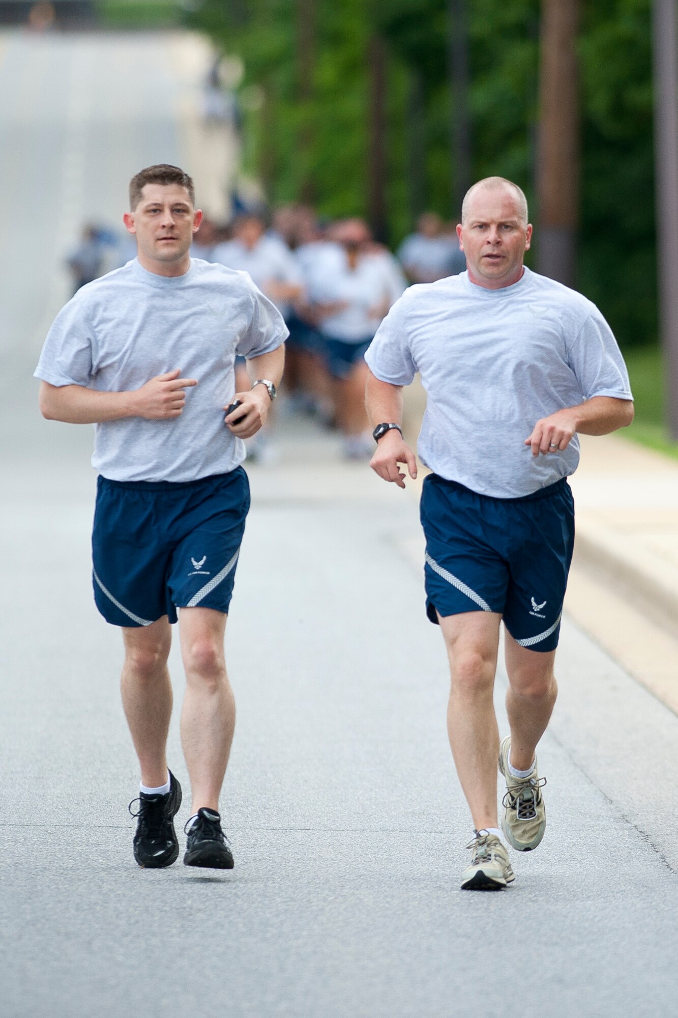 Chief Master Sgt. James Hotaling, Command Chief Master Sergeant of the Air National Guard (right), and Senior Master Sgt. Robert Vance, superintendent of Executive Services at the ANG Readiness Center, Joint Base Andrews, Md., participate in a D-Day memorial run at Joint Base Andrews, Md. June 6, 2013. The group run designed to build teamwork and camaraderie between members of the Army National Guard and Air National Guard marked the 69th anniversary of the allied invasion of Western Europe in World War II. (U.S. Air National Guard photo by Master Sgt. Marvin R. Preston/RELEASED)