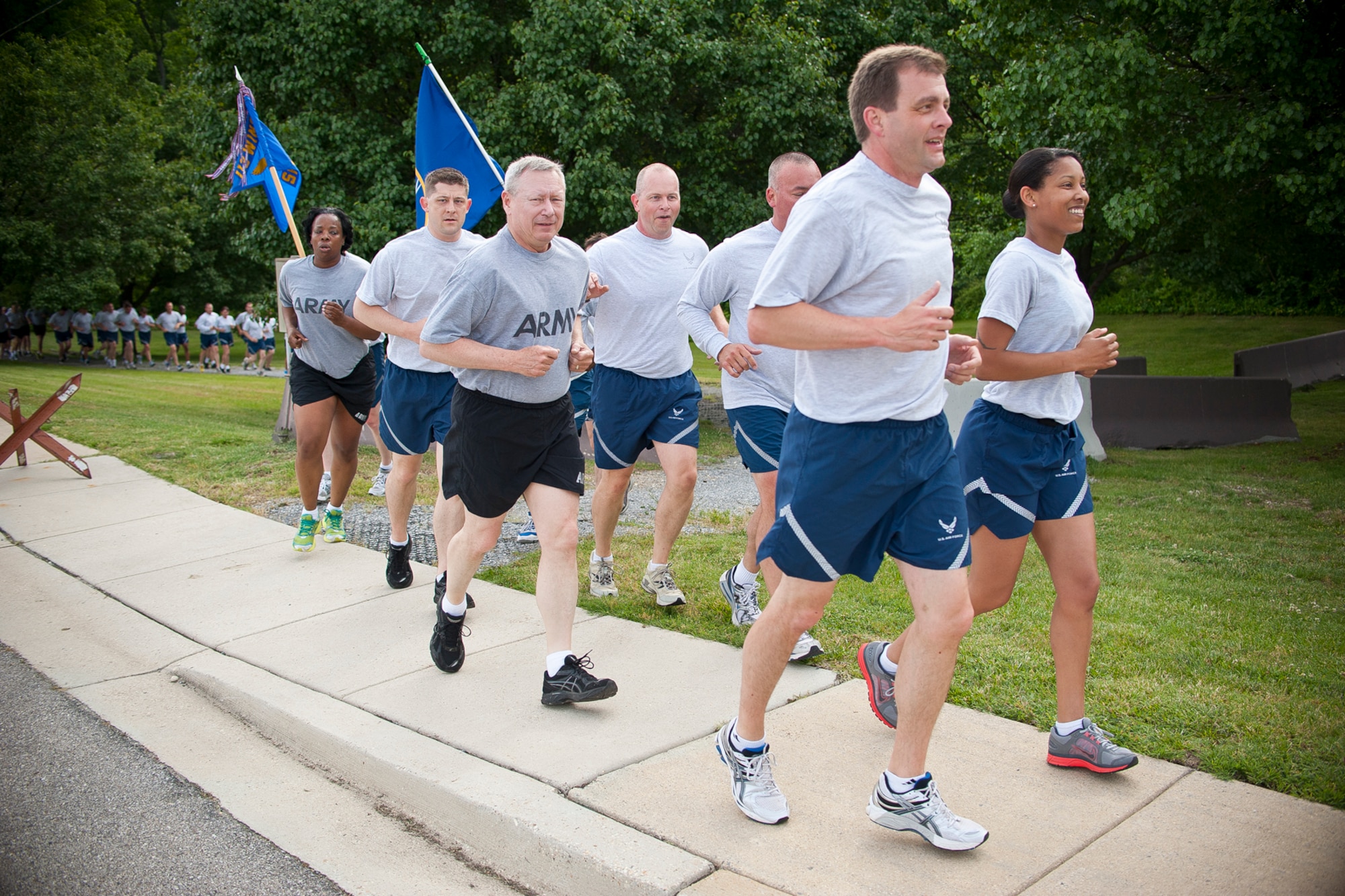 Army Gen. Frank J. Grass, the chief of the National Guard Bureau, leads Soldiers and Airmen on a D-Day memorial run at Joint Base Andrews, Md., June 6, 2013. The group run designed to build teamwork and camaraderie between members of the Army National Guard and Air National Guard marked the 69th anniversary of the allied invasion of Western Europe in World War II. (U.S. Air National Guard photo by Master Sgt. Marvin R. Preston/RELEASED)