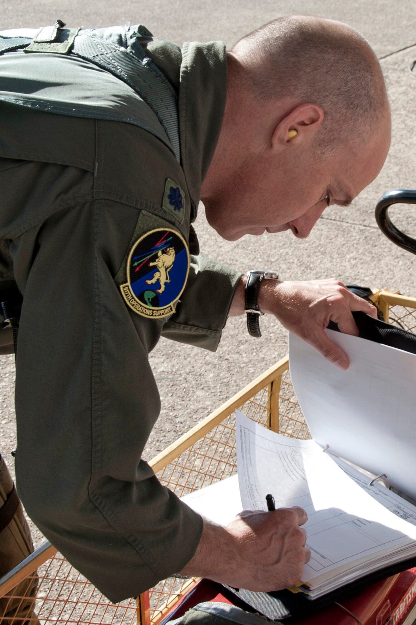 U.S. Air Force Lt. Col. Tim Schultz, pilot, 47th Fighter Squadron, signs  for an A-10 Thunderbolt II jet aircraft at Barksdale Air Force Base, La., June 3, 2013. Colonel Schultz is piloting one of six A-10s being flown to Davis-Monthan Air Force Base, Ariz. Upon arrival, Col. Schultz will sign responsibility of the aircraft over to someone else. The transfer of the A-10s from Barksdale is due to the recent Force Structure Action Implementation Plan that dictates the 917th Fighter Group at Barksdale will be inactivated this year on the last day of September. (U.S. Air Force photo by Master Sgt. Jeff Walston)