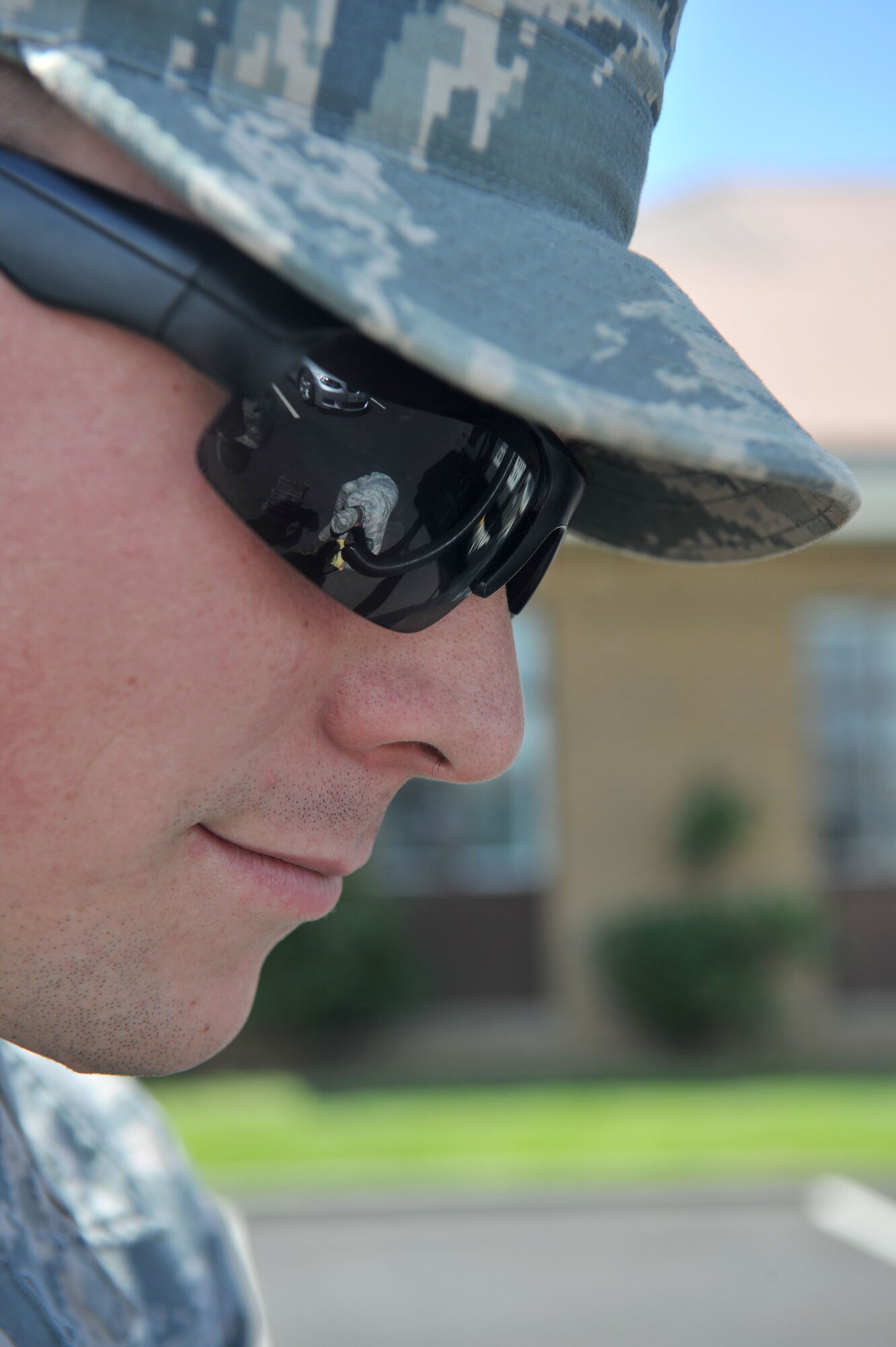 Airman 1st Class Maxwell Davis, 100th Civil Engineer Squadron Horizontal Shop pavements and construction equipment journeyman from Bakersfield, Calif., keeps a close eye on Chief Master Sgt. Tracy Jones, 100th Air Refueling Wing command chief, as he learns how to clear a sub-surface drainage system June 5, 2013, on RAF Mildenhall, England. Jones worked alongside the Airmen and civilians of the 100th CES Horizontal Shop as part of the base’s “Dirty Jobs” program. (U.S. Air Force photo by Staff Sgt. Jerilyn Quintanilla/Released)