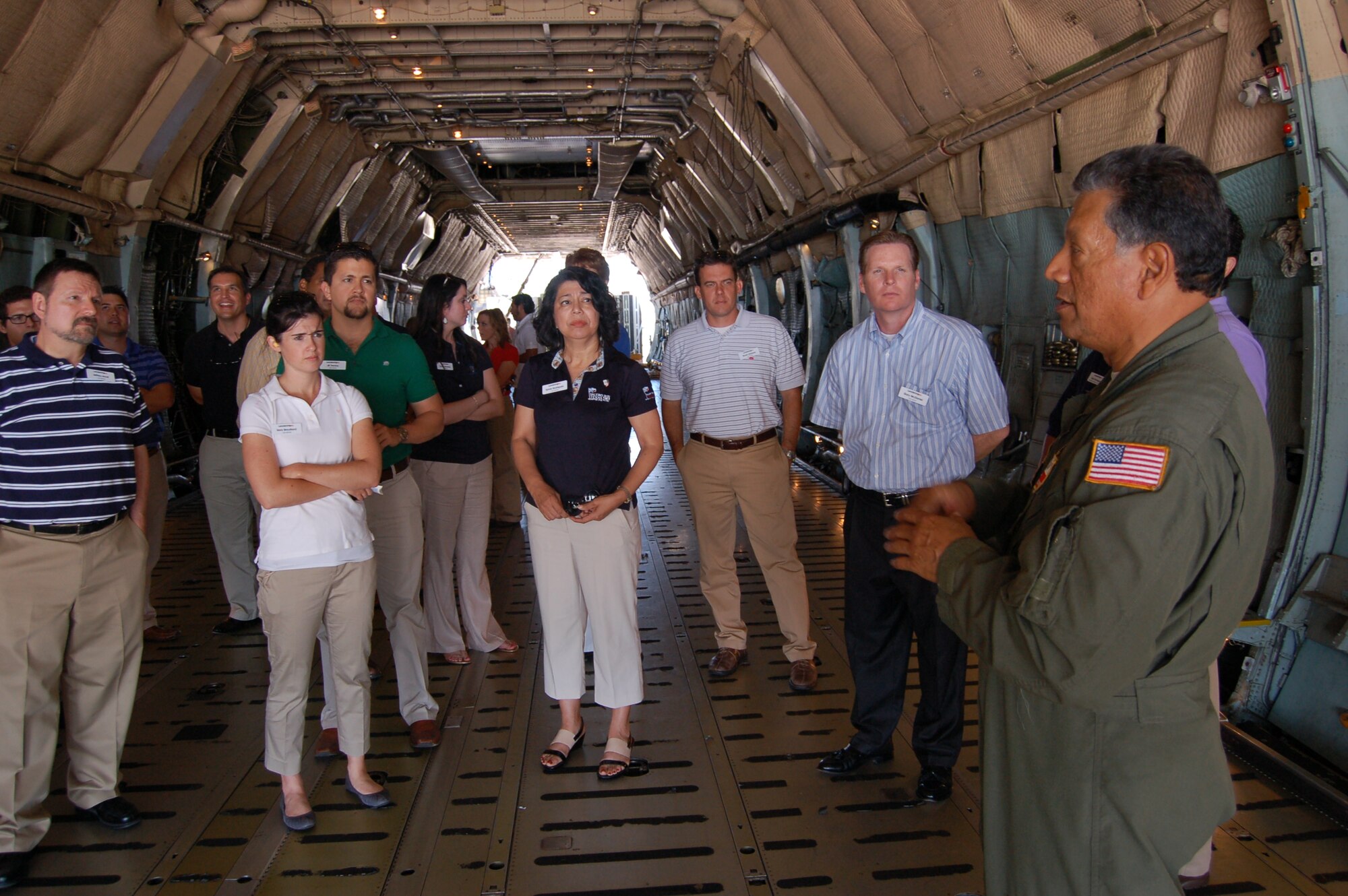 Senior Master Sgt. Charles Cardenas, a 356th Airlift Squadron loadmaster, explains his duties inside a C-5A Galaxy's cargo hold to participants of Leadership San Antonio Class 38 during their visit June 5, 2013 to the 433rd Airlift Wing. The tour was part of the day's events which highlighted the diverse missions of Joint Base San Antonio-Lackland and focused on military and veterans' affairs.