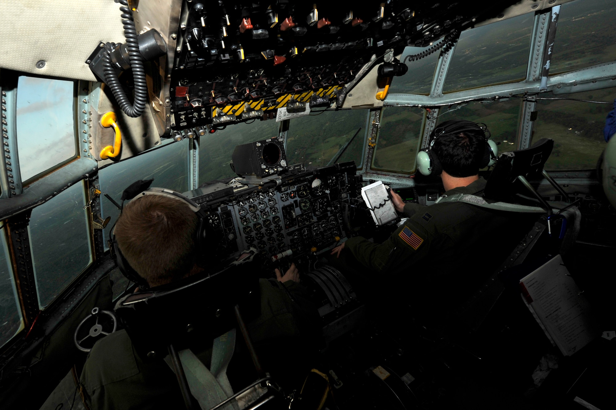 Capt. Jason Jones, a 53rd Airlift Squadron pilot, and Capt. Gergely Harton, a 53rd AS co-pilot, fly a C-130 into final approach after Operation Joint Forcible Entry May 31, 2013, at Little Rock Air Force Base, Ark. Jones and Harton piloted a C-130 from Little Rock AFB that was part of a 10 aircraft C-130 formation. (U.S. Air Force photo by Senior Airman Rusty Frank)