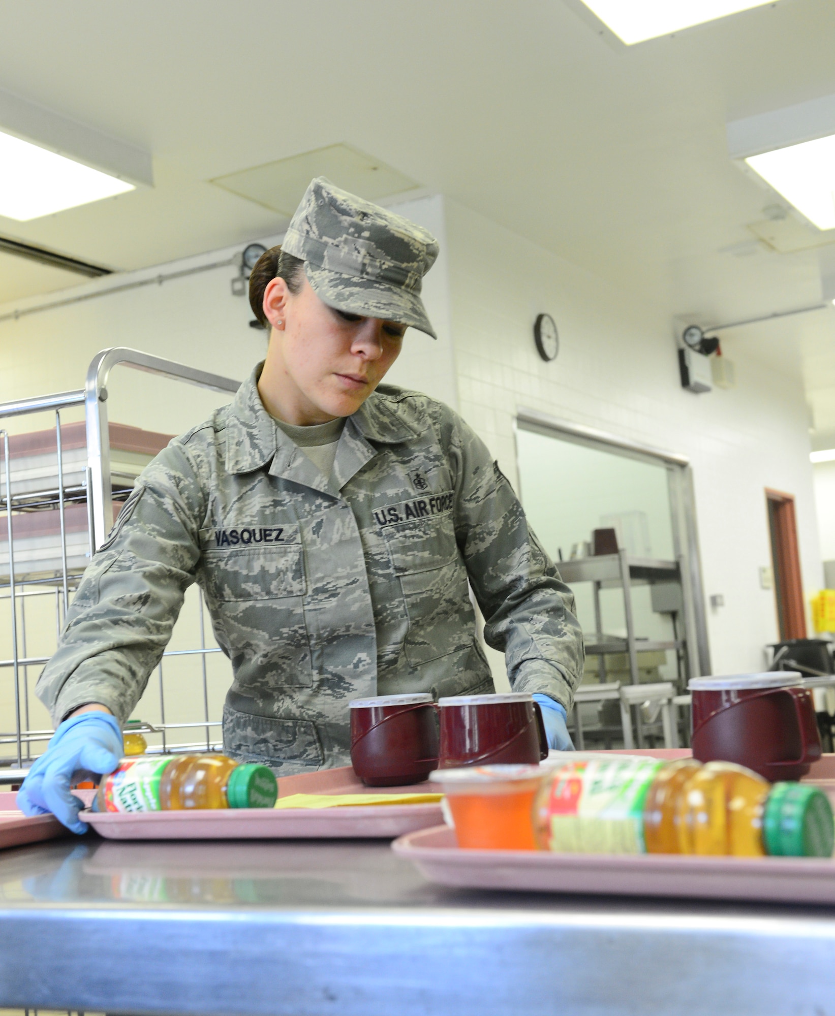ROYAL AIR FORCE LAKENHEATH, England – Staff Sgt. Valerie Vasquez, 48th Medical Support Squadron nutritional medicine clinical NCO in charge, surveys meal trays for patients May 15, 2013. The 48th MDSS provides thousands of patients and staff with a healthy food selection during their time at the hospital, to promote a fit and healthy force.(U.S. Air Force photo by Staff Sgt. Stephanie Mancha)