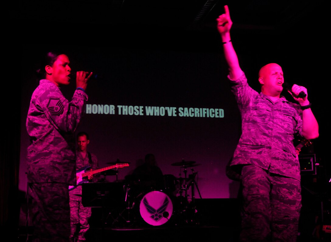 Max Impact, The U.S. Air Force’s premier rock ensemble, performs their latest song “Stand” for members of The Air Force Association April 10, 2013. The AFA is a non-profit aerospace education association who toured the 11th Operations Group in order to gain a better understanding of the group’s internal and overall mission. (U.S. Air Force photo/Senior Airman Lindsey A. Porter)