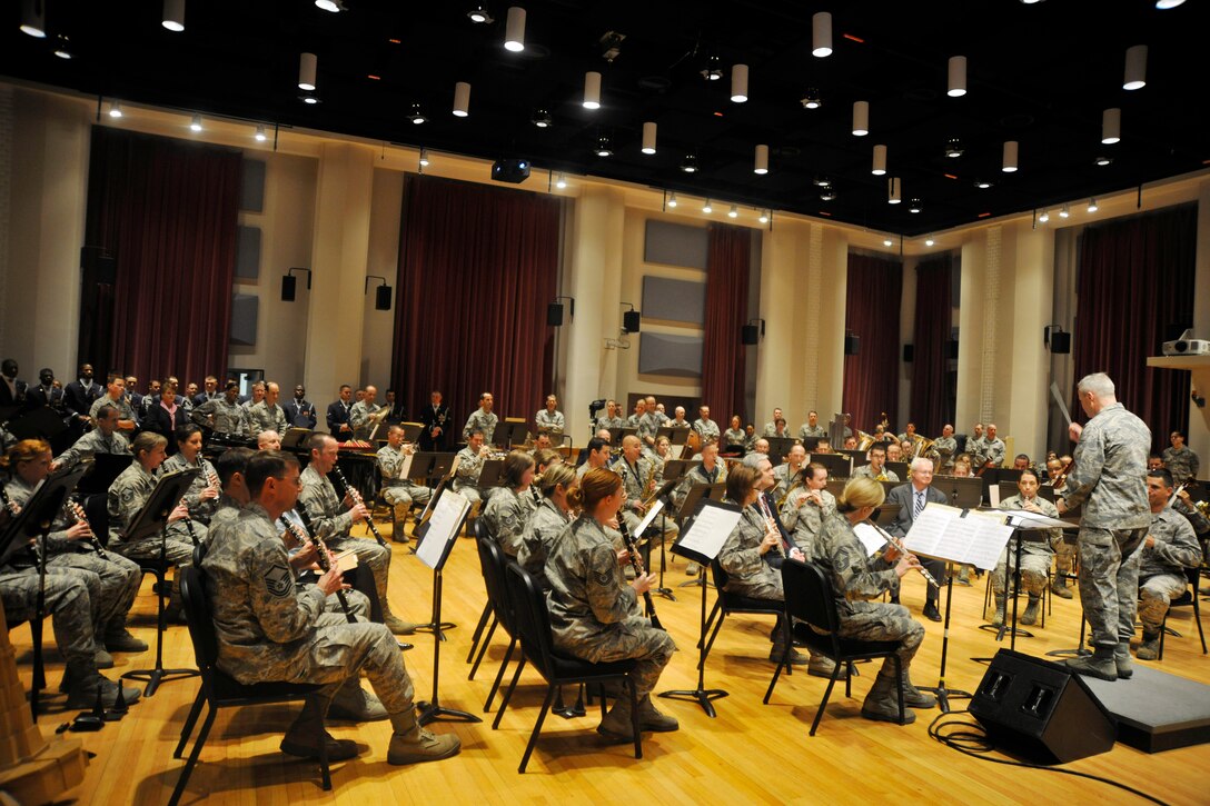 Col. Larry Lang, commander for The U.S. Air Force Band, conducts members of The U. S. Air Force Concert Band during their performance for an Air Force Association leadership immersion April 10, 2013. Members of the The AFA toured the 11th OG in order to gain a better understanding of the group’s internal and overall mission with stops including visits to various other Air Force Band and Honor Guard ensembles.   (U.S. Air Force photo/Senior Airman Lindsey A. Porter)