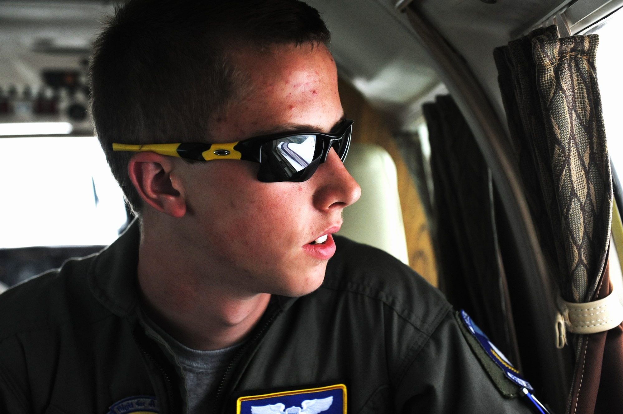 Clayton Reese, pilot for a day and sufferer of Cystic Fibrosis, looks out the window of a Piper P-31 that was flown by the Wings of Hope program pilots May 31. Cystic fibrosis is an autosomal recessive genetic disorder that affects most critically the lungs, and also the pancreas, liver, and intestine. (U.S. Air Force photo/Senior Airman Jake Eckhardt)