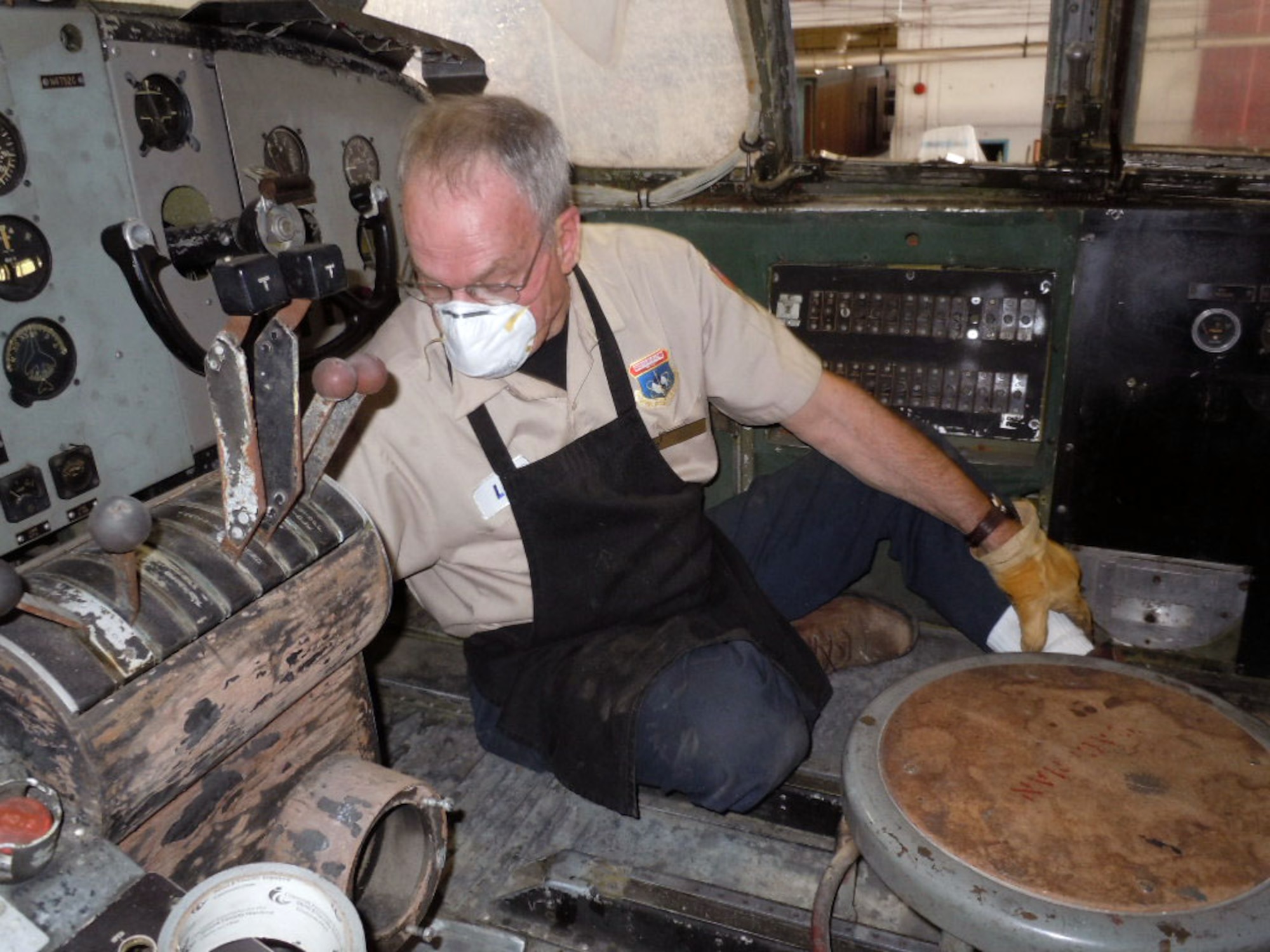 DAYTON, Ohio -- Volunteer Lou Thole works in the C-82 flight deck. (Photo courtesy of Garry Guthrie)