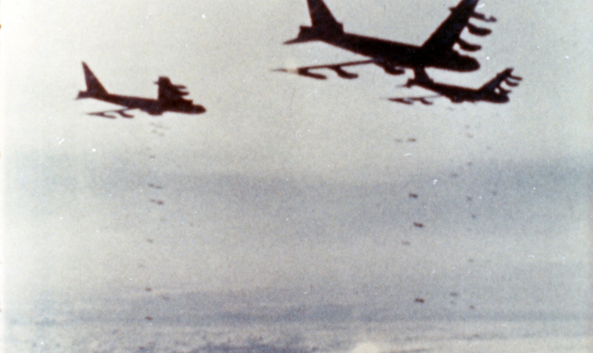 Air Force B-52s drop their loads of bombs on a close air support mission over Khe Sanh. Even from very high altitudes, they could accurately place their bombs within one-sixth of a mile of the besieged American forces. The aerial bombing campaign in support of the besieged American forces at Khe Sanh was named OPERATION NIAGARA for this “waterfall” of bombs. (U.S. Air Force photo)