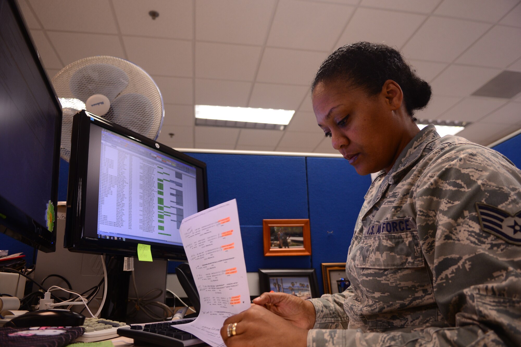 Staff Sgt. Kristi Craft, 31st Comptroller Squadron financial services technician, looks over general schedule civilian timecards May 16, 2013, at Aviano Air Base, Italy. Craft, a six-year individual mobilization augmentee reservist, was active duty for 11 years before switching over to the Air Force Reserve. (U.S. Air Force photo/Airman 1st Class Briana Jones).