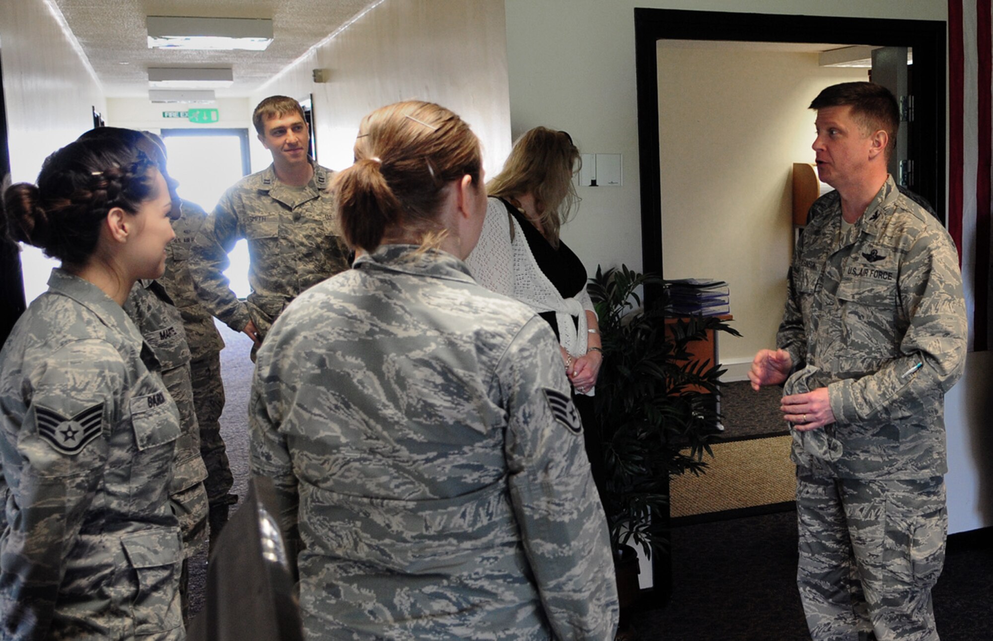 ROYAL AIR FORCE LAKENHEATH, England – Col. Kyle Robinson, 48th Fighter Wing commander (right), speaks with the staff of the Special Victims’ Counsel and Sexual Assault Response Coordinator offices at the opening of the Air Force’s first collocated sexual assault victim support facility in Building 1070 June 3, 2013. The SVC is a new Air Force pilot program to support victims and assist with understanding legal proceedings. (U.S. Air Force photo by Staff Sgt. Thomas Trower)