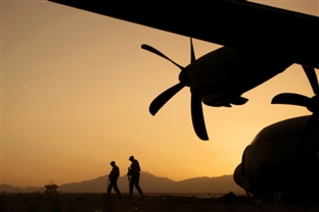 U.S. Air Force Airman 1st Class Christian Mejia and U.S. Air Force Staff Sgt. Duron Arnold perform a security check around a disabled C-130 Hercules aircraft on Forward Operating Base Shank in Afghanistan's Logar province, June 6, 2013. Mejia and Duron, assigned to the 376th Expeditionary Security Forces Squadron Fly Away Security Team, are forward deployed from Manas Air Base, Kyrgyzstan. 