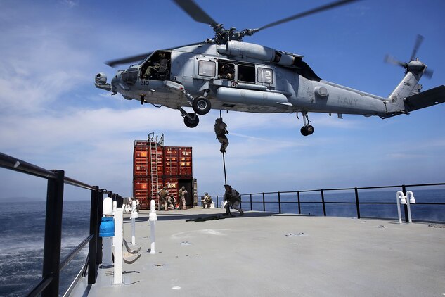 Members of 1st Marine Special Operations Battalion practice boarding and searching ships. Marines train for Visit, Board, Search and Seizure (VBSS) at the highest level. This type of interdiction involves a non-compliant ship, underway, and opposed.