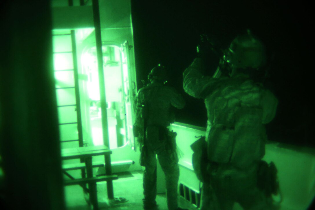 Members of 1st Marine Special Operations Battalion practice boarding and takedown of a ship at night. Marines train for Visit, Board, Search and Seizure (VBSS) at the highest level. This type of interdiction involves a non-compliant ship, underway, opposed, and at night.