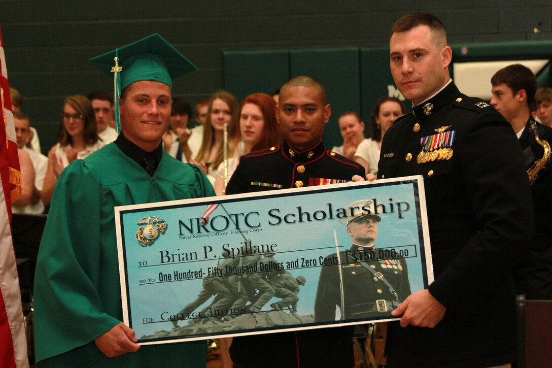 Brian Spillane, a resident of Mansfield, Ma., and recent graduate of Mansfield High School, is one of this year’s Naval Reserve Officer Training Corps Scholarship Program, Marine Corps Option, recipients. Sgt. Teruhisa Okada, center, a Marine Recruiter, and Capt. Thomas Abbott, the Executive Officer of Marine Corps Recruiting Station Springfield, Mass., present Spillane with the $150,000 scholarship during a high school awards ceremony June 5, 2013, at the school. 