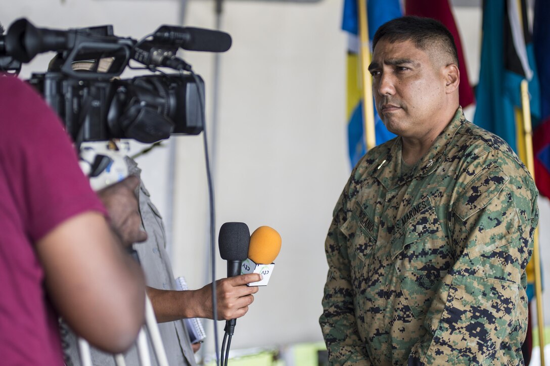 U.S. Marine Corps Col. Augustine Bolanio, Director of Exercises, U.S. Marine Corps South, speaks with Saint Lucia media during the opening ceremony of Tradewinds 2013. Tradewinds 2013 is a joint, combined exercise conducted in conjunction with partner nations to enhance the collective abilities of defense forces and constabularies to counter transnational organized crime and to conduct humanitarian/disaster relief operations. (Official Marine Corps Photo by SSgt Earnest J. Barnes/Released)
