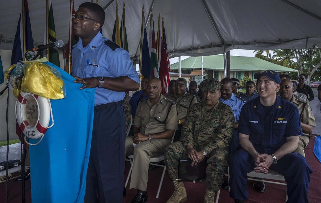 Royal Saint Lucia Police Constable Irvin Alfred, the master of ceremonies during the opening ceremony of Tradewinds 2013, welcomes the participants for the exercise during his opening remarks. Tradewinds 2013 is a joint, combined exercise conducted in conjunction with partner nations to enhance the collective abilities of defense forces and constabularies to counter transnational organized crime and to conduct humanitarian/disaster relief operations. (U.S. Navy photo by Mass Communication Specialist 1st Class Paul Seeber/Released)