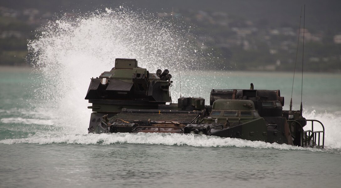 MARINE CORPS BASE HAWAII - An amphibious assault vehicle makes its way back to shore during a water-training exercise on Marine Corps Base Hawaii, June 4. The purpose of the exercise was to familiarize Marines with the AAV, how it’s operated, and their role within the vehicle. (U.S. Marine Corps photo by Lance Cpl. Matthew Bragg)
