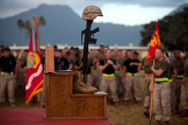MARINE CORPS BASE HAWAII - Members of 3rd Marine Regiment form up in front of the pedestal where 119 names of fallen heroes of 3rd Marines were called on Marine Corps Base Hawaii, June 06. Marines and sailors wearing black shirts ran up to the pedestal and hung their fallen service member’s dog tags. (U.S. Marine Corps photo by Lance Cpl. Matthew Bragg)