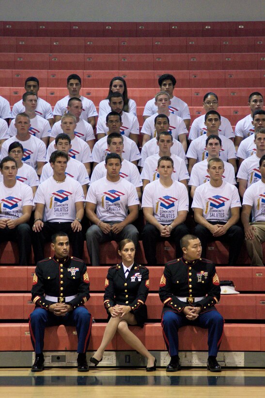 Marine Corps recruiters with Recruiting Station Fort Lauderdale, Fla., participate in an Our Community Salutes ceremony for Palm Beach County enlistees May 9, 2013. Our Community Salutes is a non-profit organization that seeks to recognize high school students who volunteer to serve in the armed forces each year. 