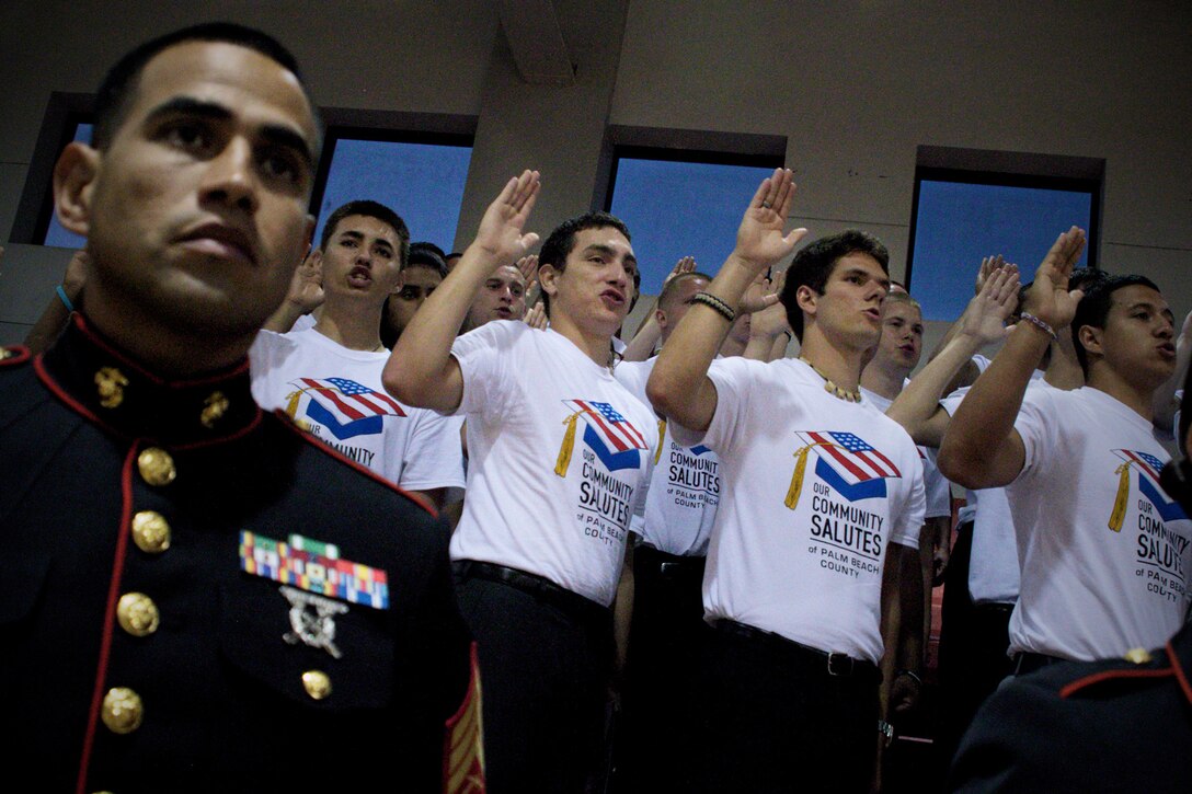 Future Marines take their oath of enlistment during an Our Community Salutes ceremony for Palm Beach County enlistees May 9, 2013. Our Community Salutes is a non-profit organization that seeks to recognize high school students who volunteer to serve in the armed forces each year.