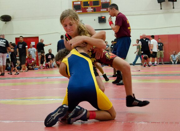 Semper Fit Wrestling Hawaii Bulldog Hailey Carson wrestles Nanea Estrella, of Upcountry Wrestling Club in Maui during a tournament at the Semper Fit Center gym, June 1, 2013. Carson took first place in her division. (U.S. Marine Corps photo by Kristen Wong)