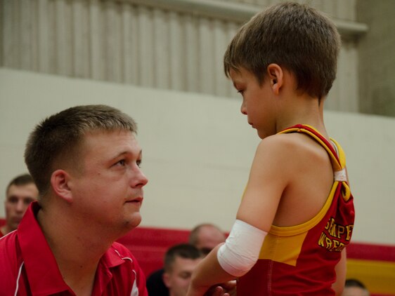 Semper Fit Hawaii Wrestling coach Theodore Proia gives wrestler Skylar Gleich a peptalk during a wrestling tournament at the Semper Fit Center gym, June 1, 2013. (U.S. Marine Corps photo by Kristen Wong)