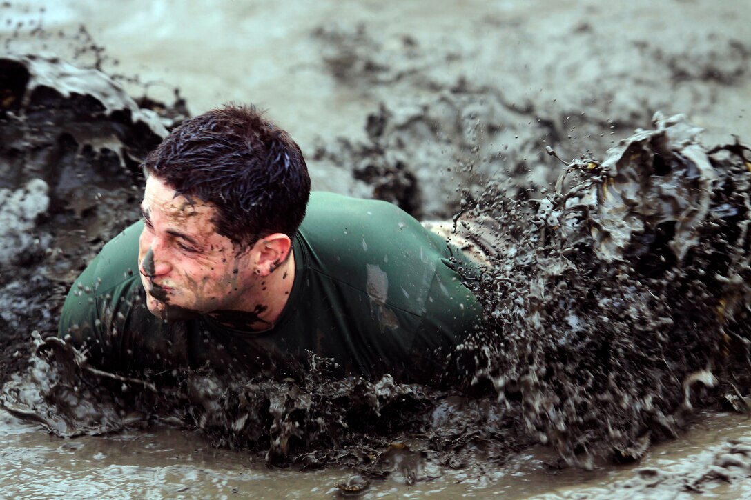 More than 600 Marines and sailors ran the 20th annual World Famous Mud Run as a part of the Commanding General’s Cup here June 7.
The service members entered in teams of five or individually and trudged through 6.2 miles of dirt, mud and off-road obstacles.
