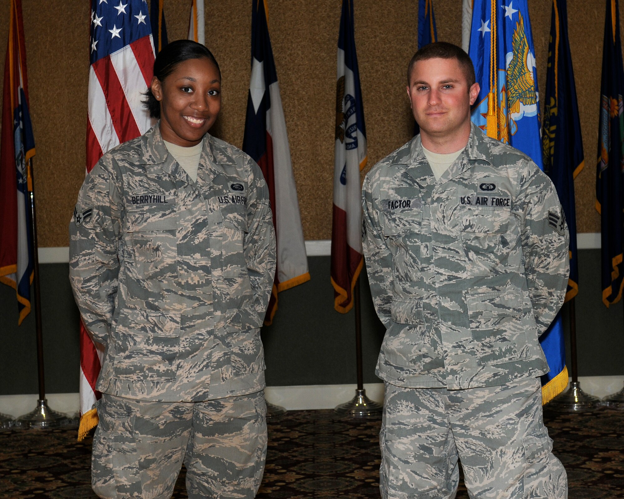Two of Team BLAZE’s newly promoted enlisted Airmen sewed on their next stripe at the enlisted promotions ceremony at the Columbus Club on May 31.  (U.S. Air Force Photo/Melissa Doublin)